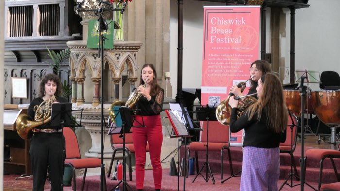 Cor8 musicians playing French horns at Chiswick Brass Festival