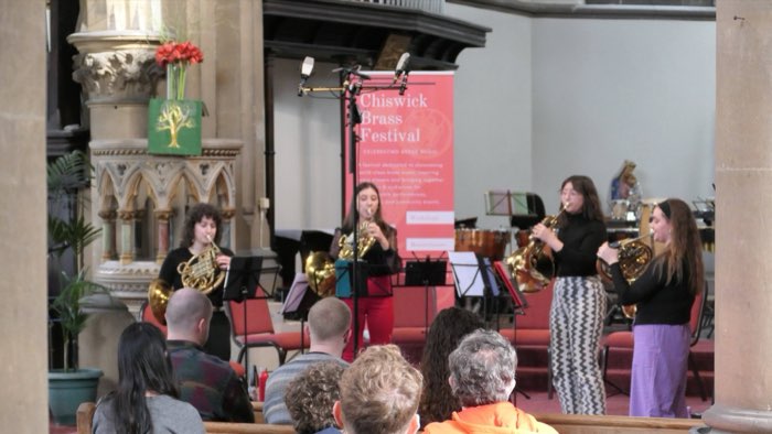 Four Cor8 horn players performing at Chiswick Brass Festival